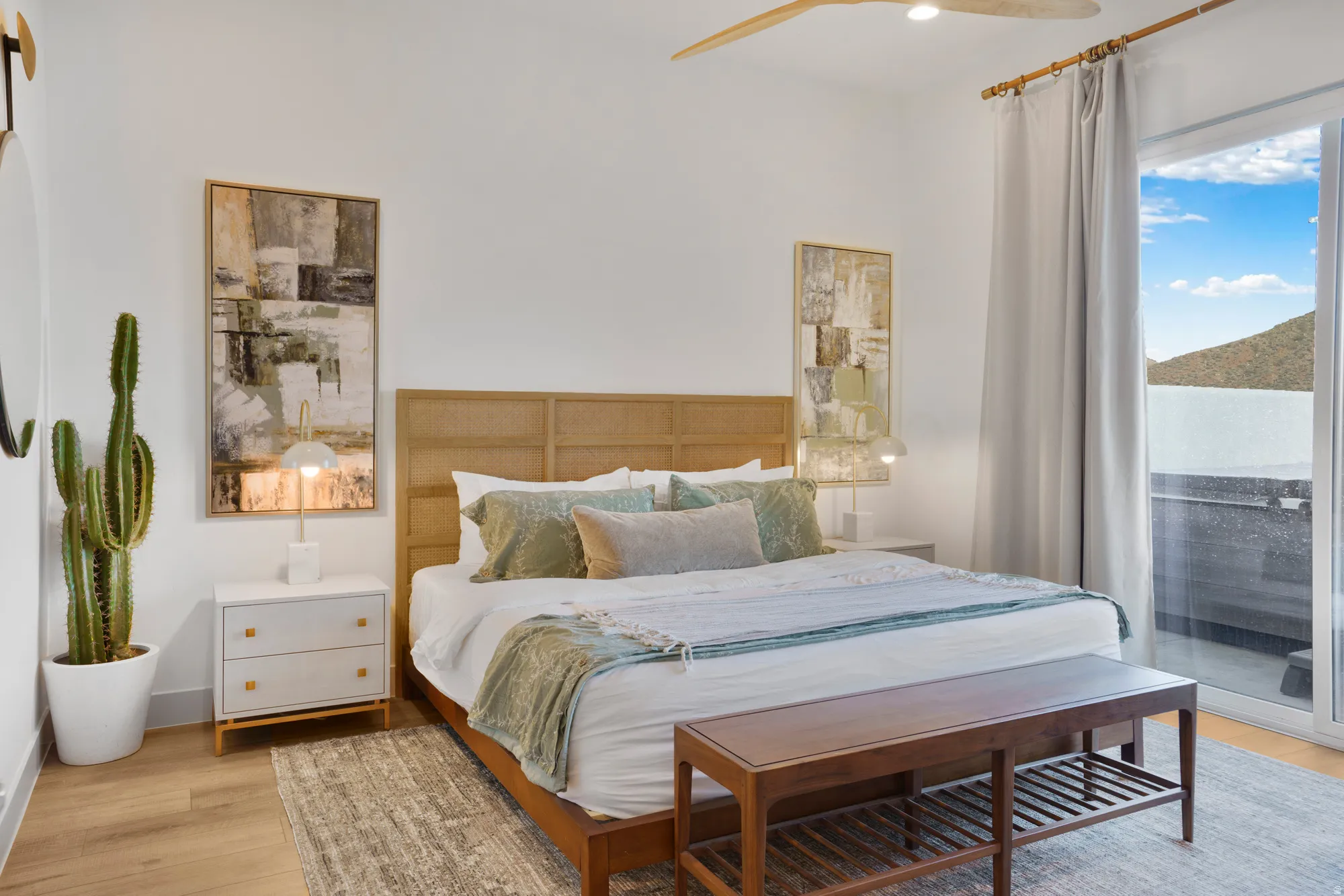 Bedroom with access to outside, light wood-style floors, and ceiling fan