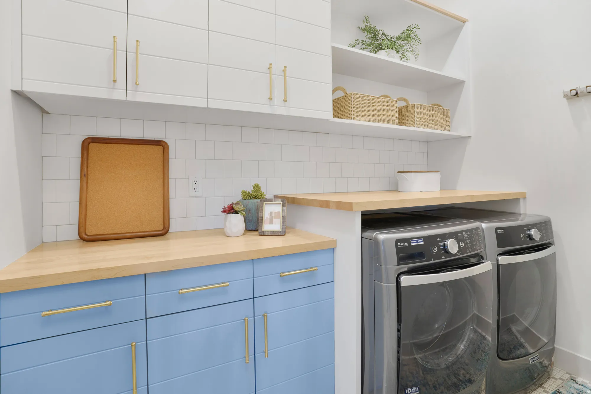 Laundry area featuring cabinet space and washing machine and clothes dryer