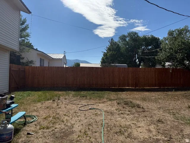 View of fenced backyard