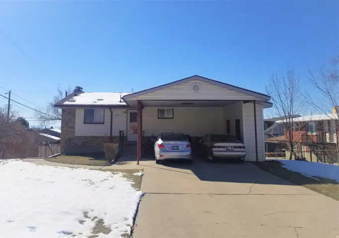 Carport and entry to upstairs unit