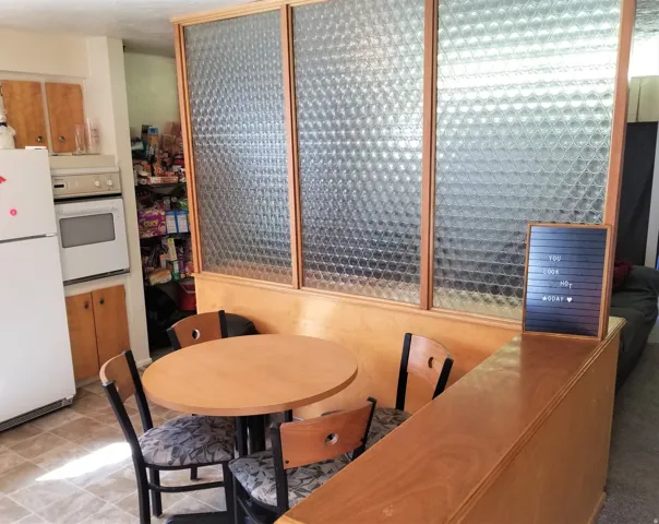 Dining area, custom privacy feature, upstairs unit