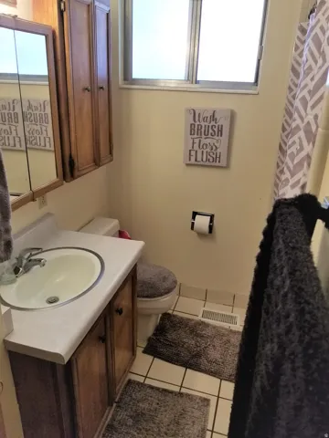 Full bath, upstairs unit