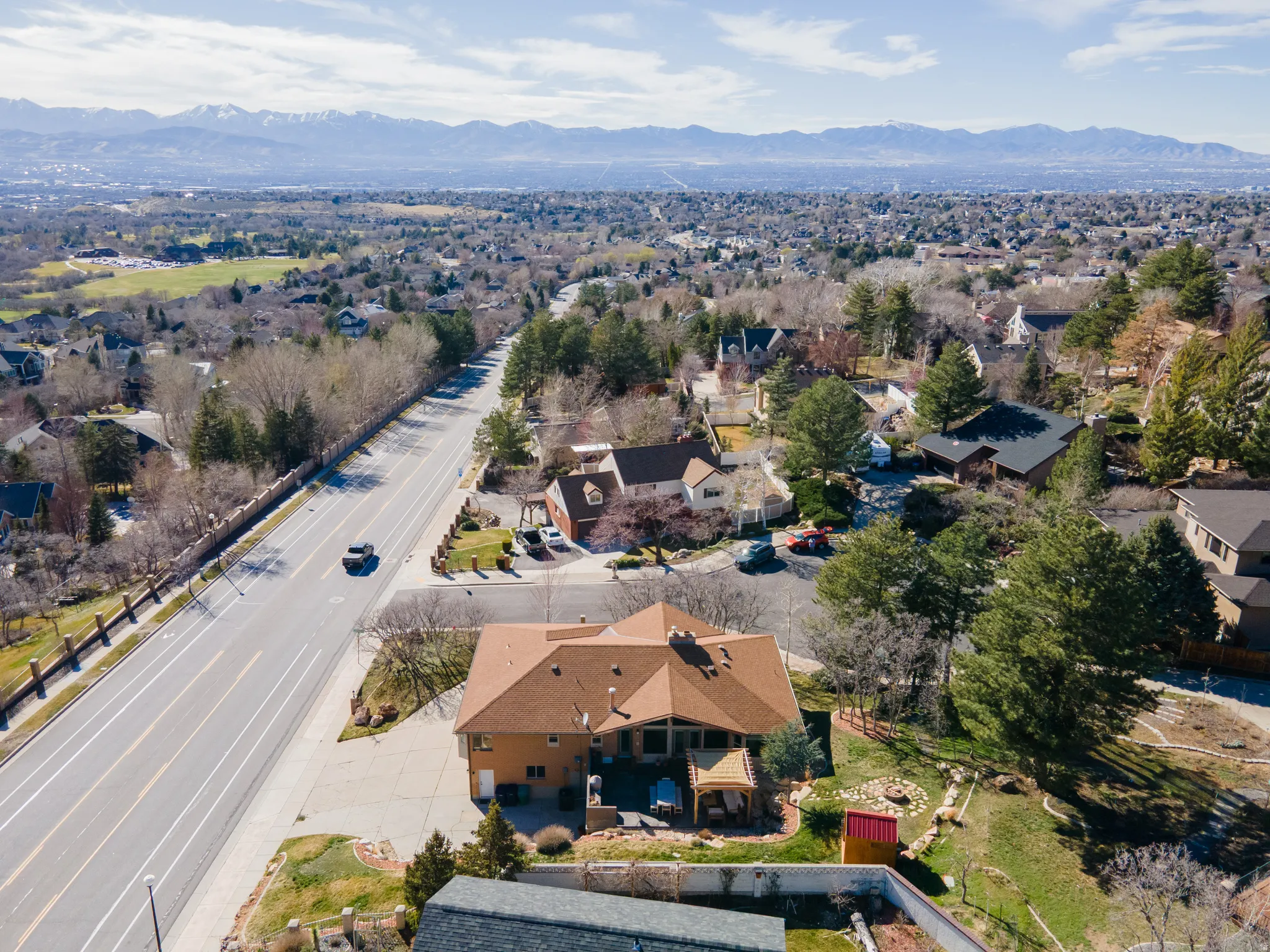 Aerial view of residential area featuring a mountainous background