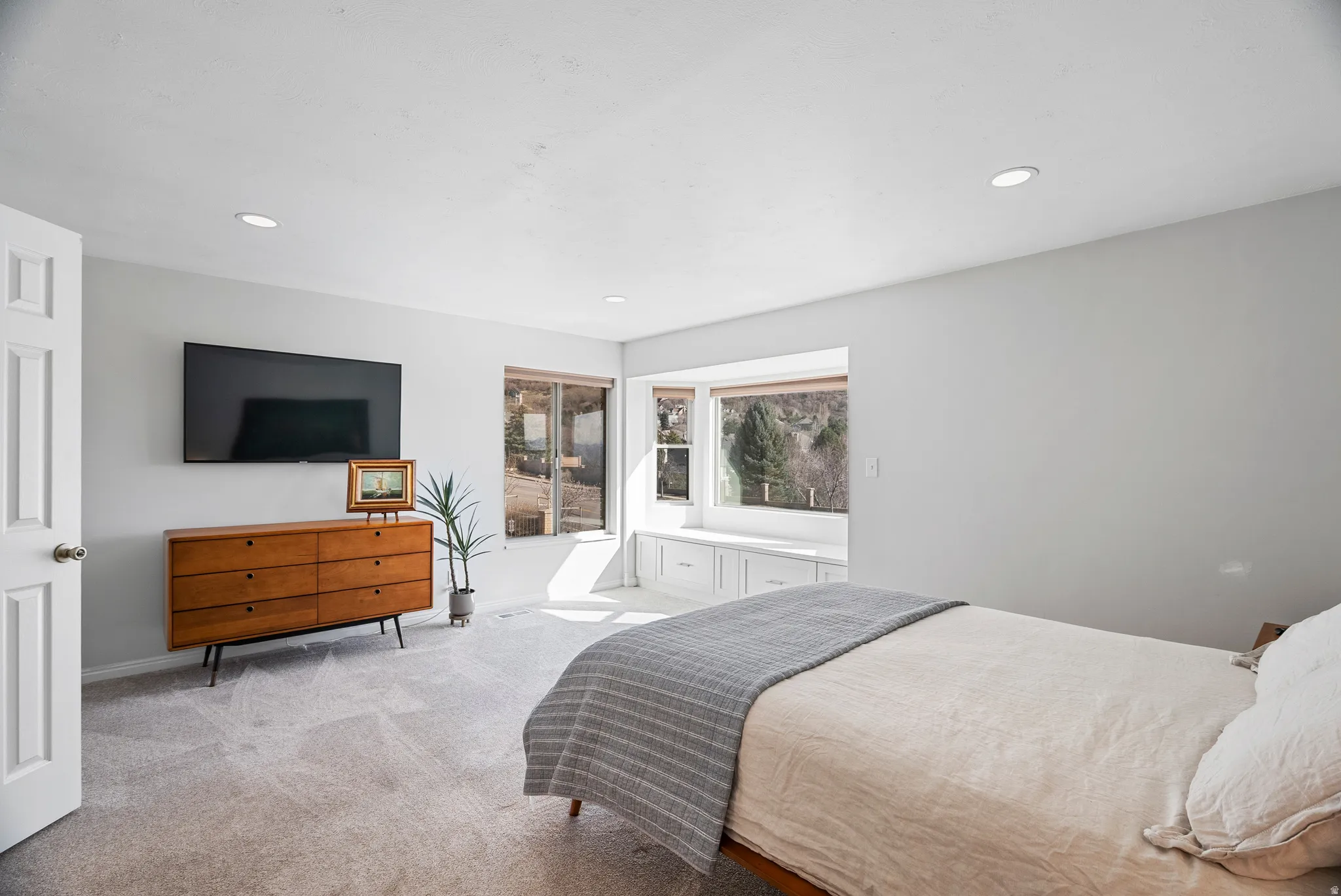 Bedroom featuring light carpet and recessed lighting