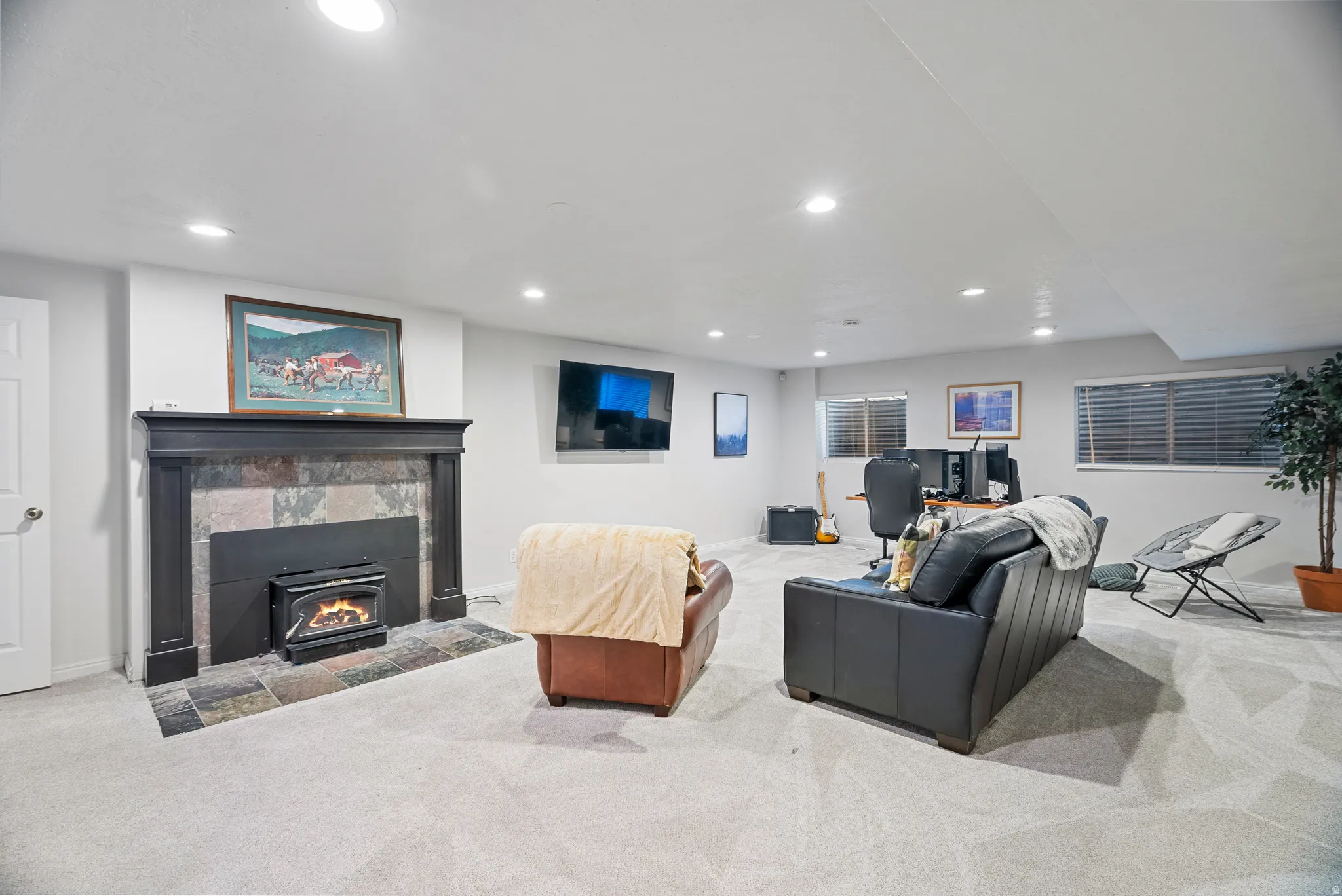 Downstairs: Living room with carpet and recessed lighting