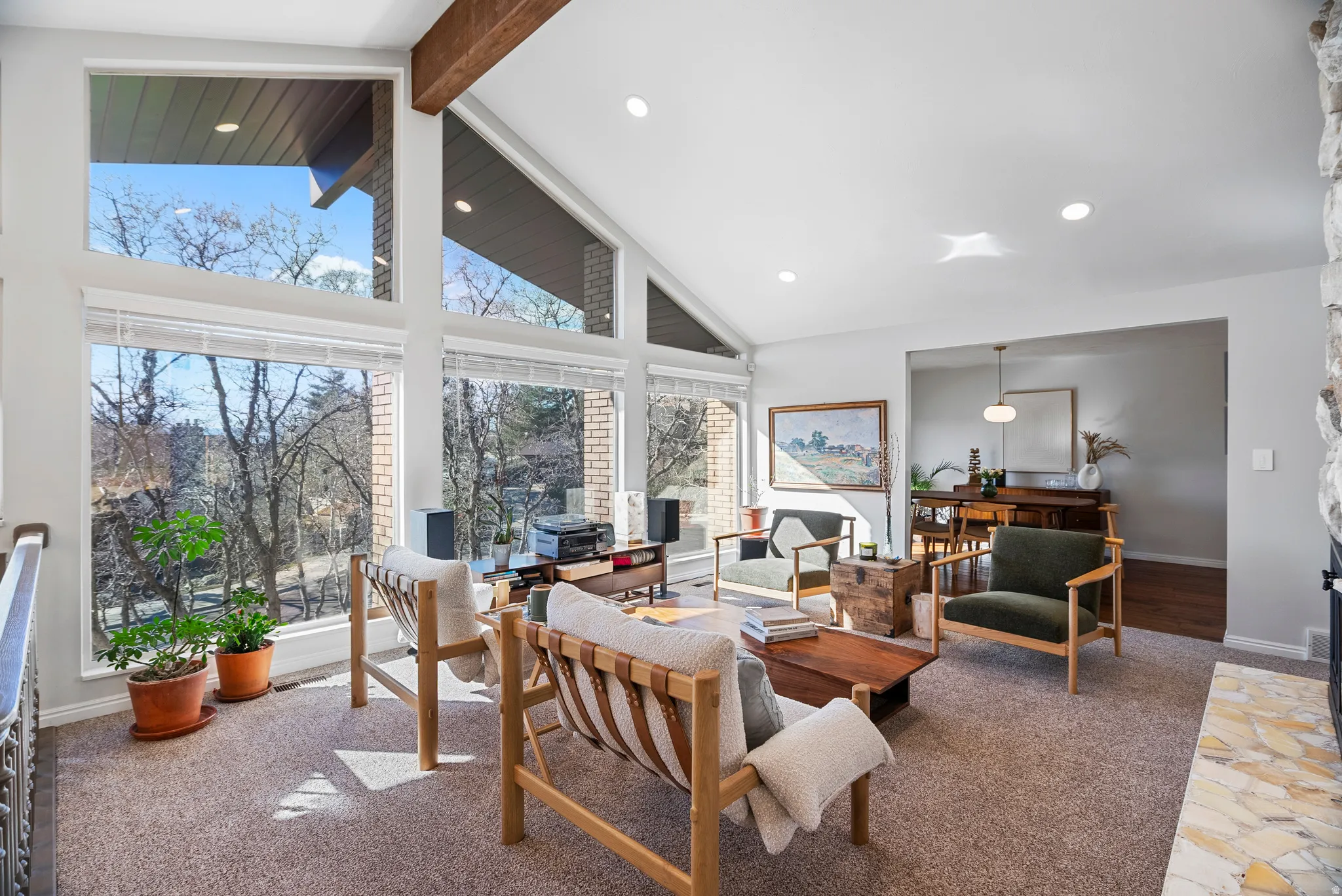 Living area featuring baseboards and recessed lighting