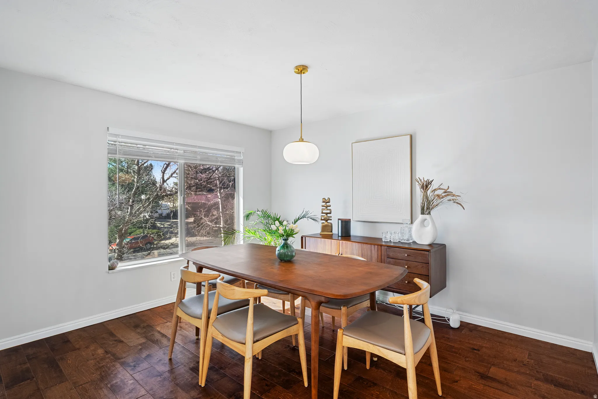 Dining space with dark wood finished floors