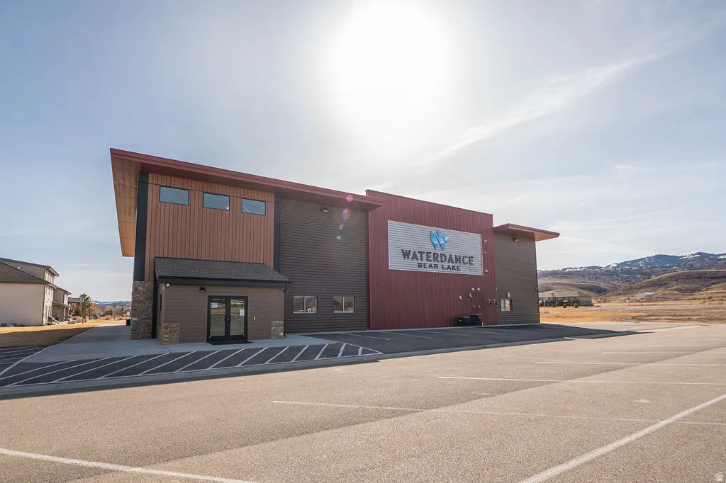 View of property with uncovered parking