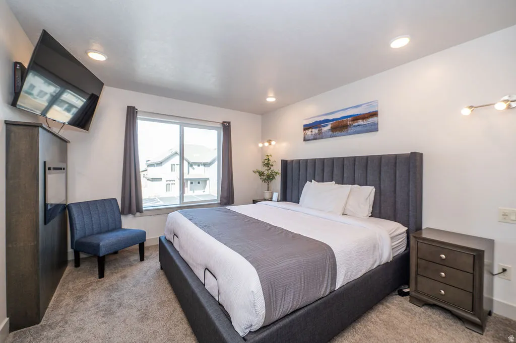 Carpeted bedroom with baseboards