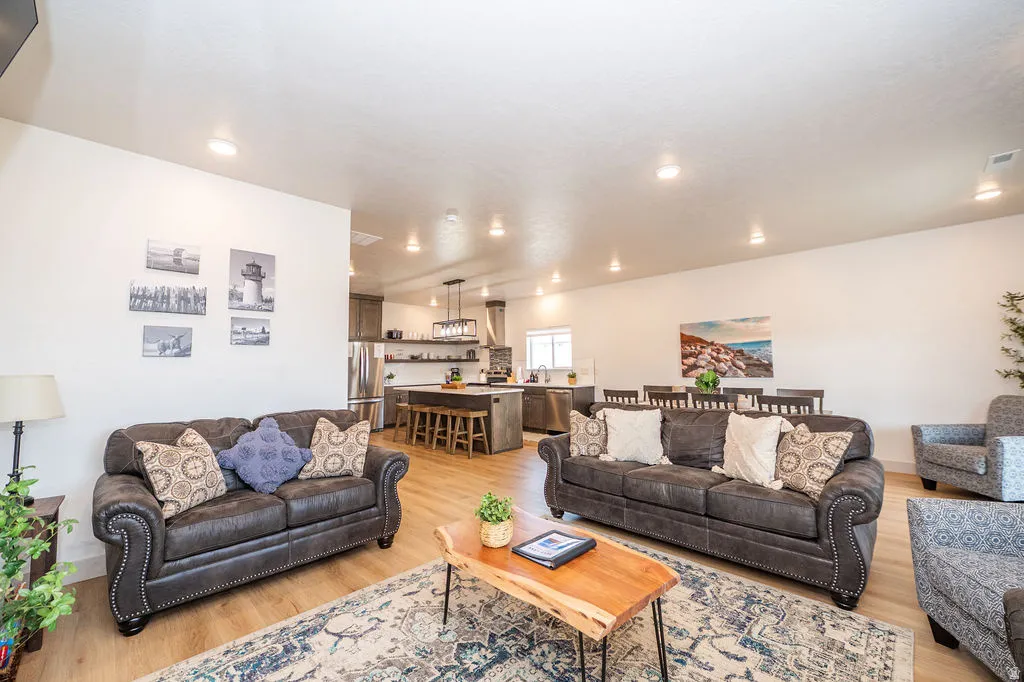 Living area featuring light wood-style flooring and recessed lighting