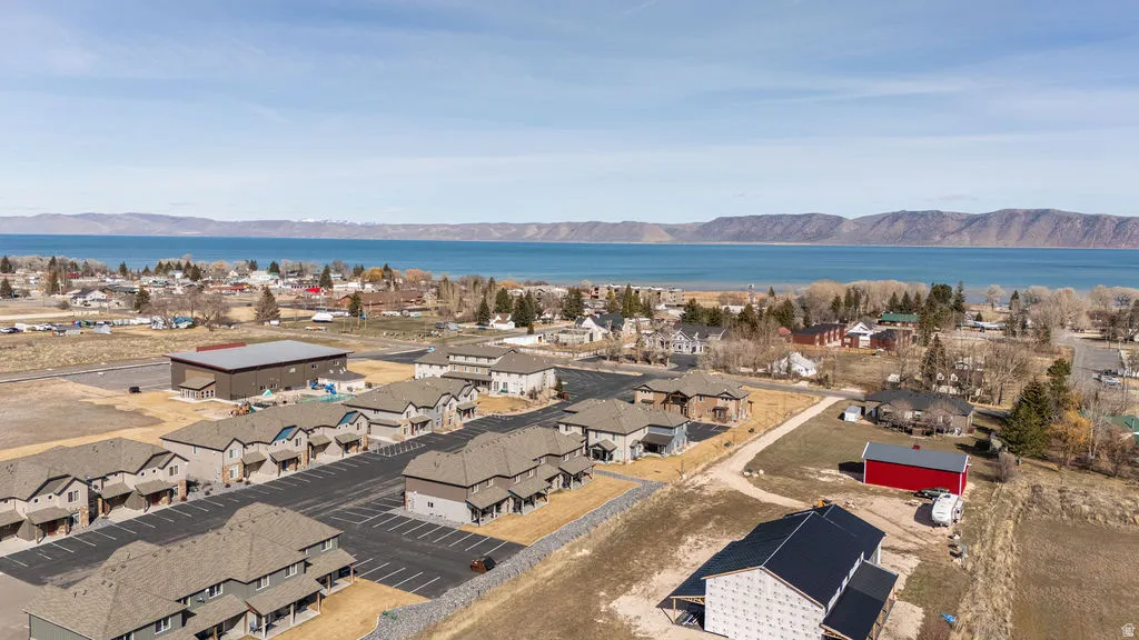 Aerial perspective of suburban area featuring a water and mountain view