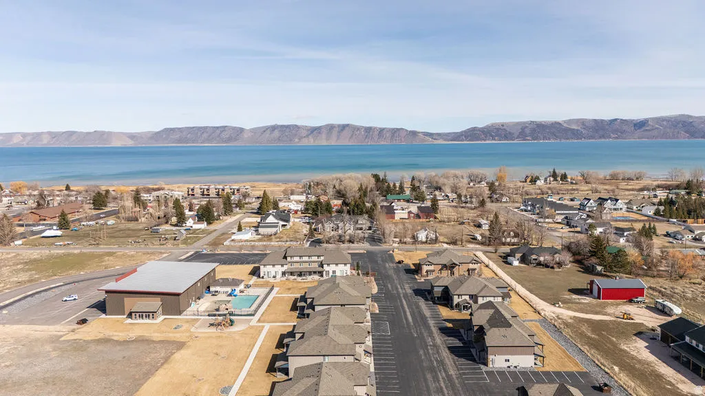 Aerial perspective of suburban area featuring a water and mountain view