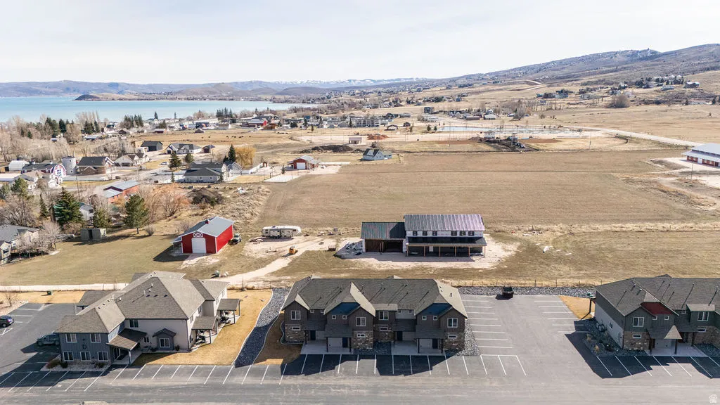 Aerial perspective of suburban area with a water and mountain view