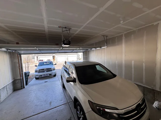 Garage featuring a garage door opener