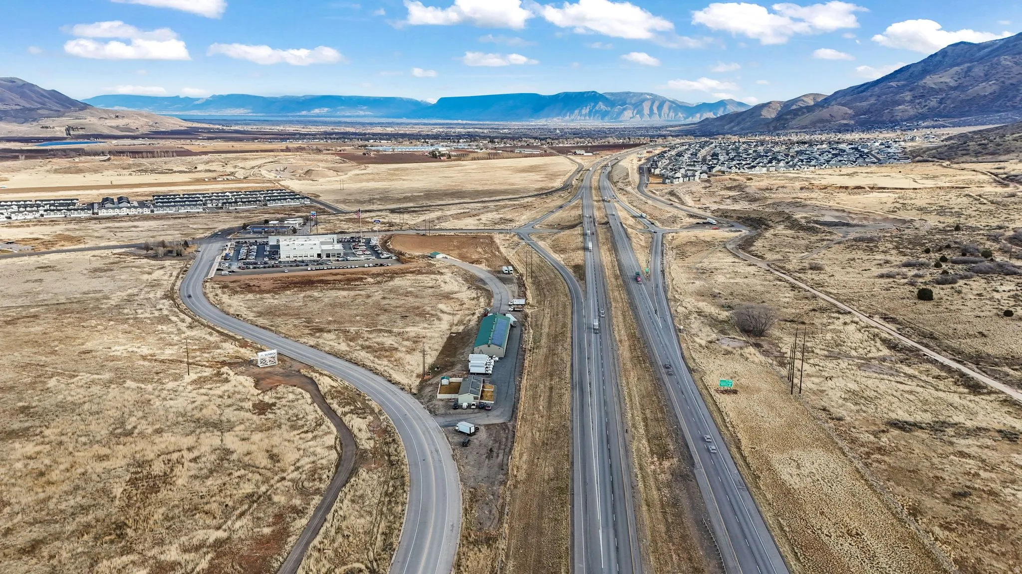 Bird's eye view of a mountainous background and a desert landscape