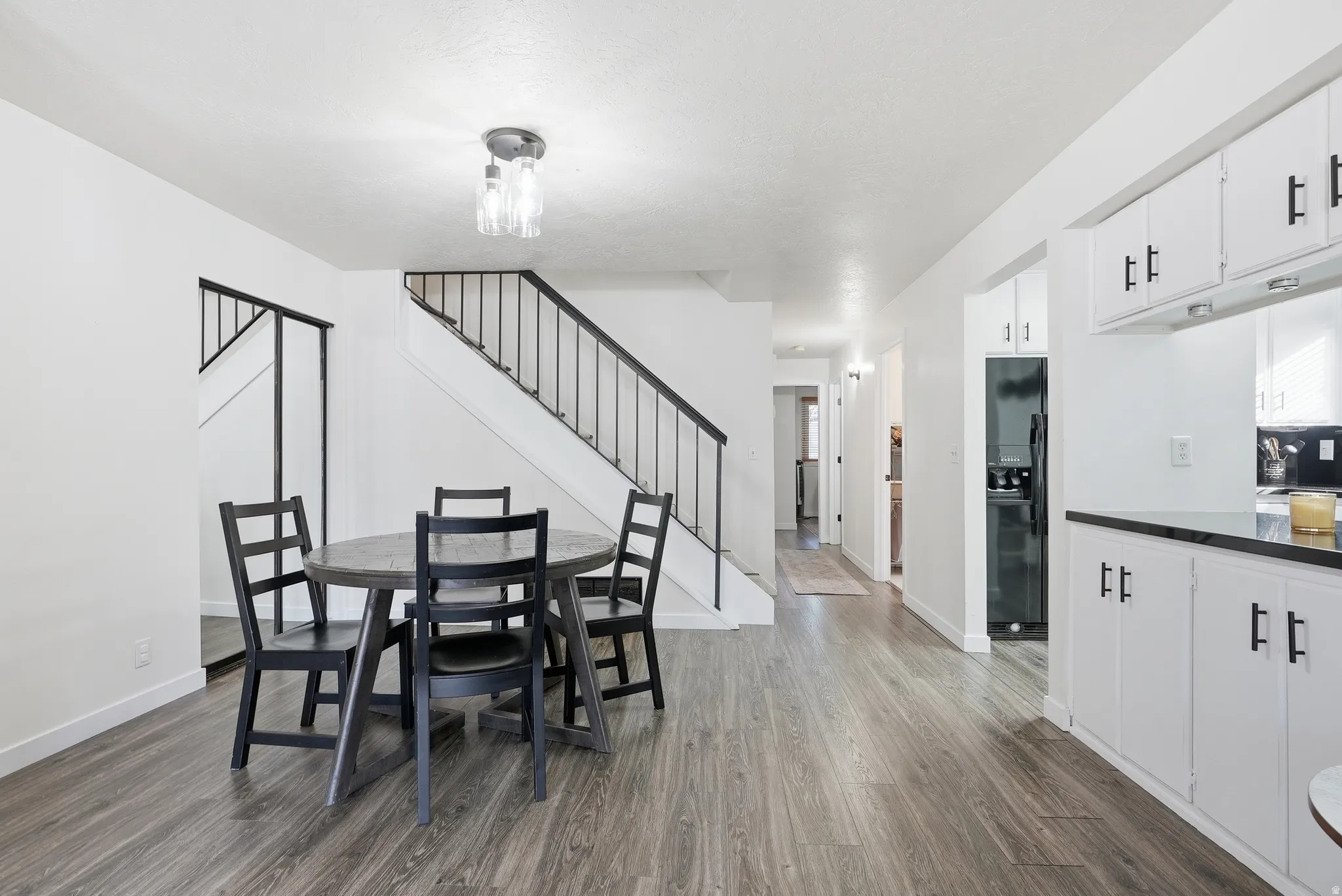 Dining area featuring stairs