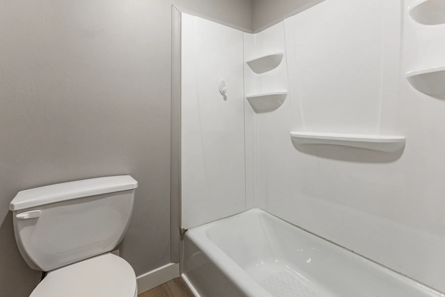 Bathroom with toilet and tub / shower combination