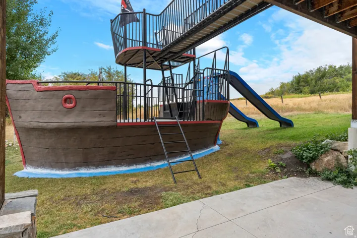 Community jungle gym with a yard
