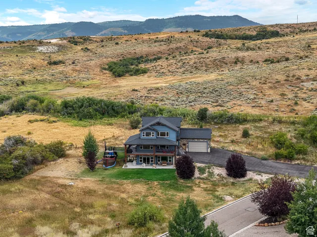 Aerial view of sparsely populated area featuring a mountain backdrop