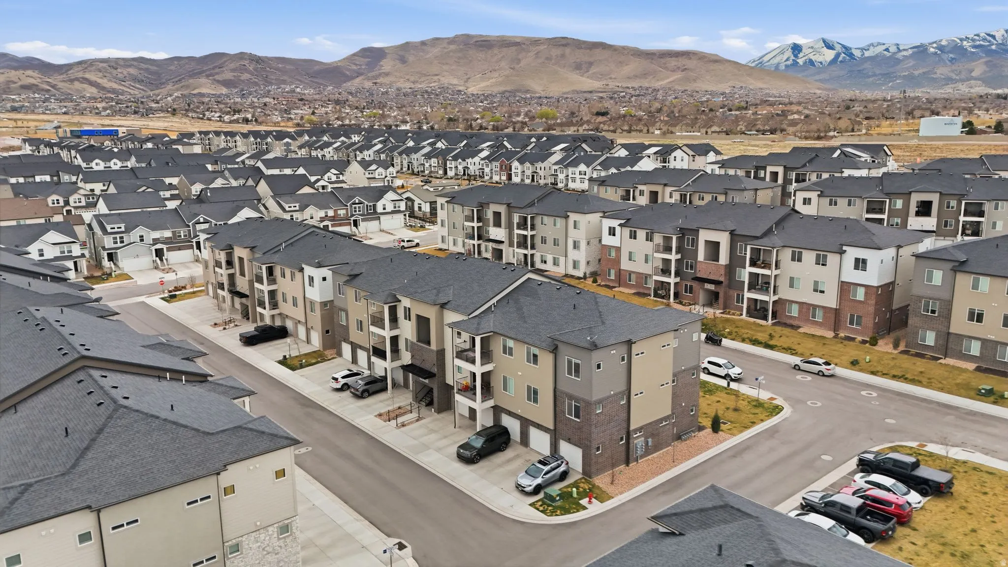 Aerial perspective of suburban area with mountains