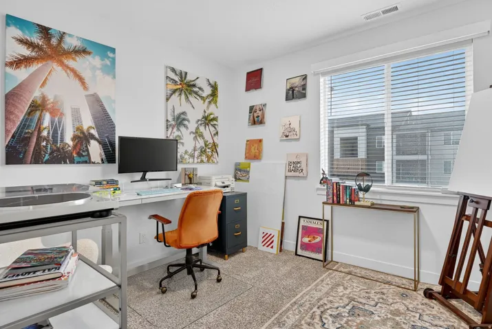 Office area featuring baseboards