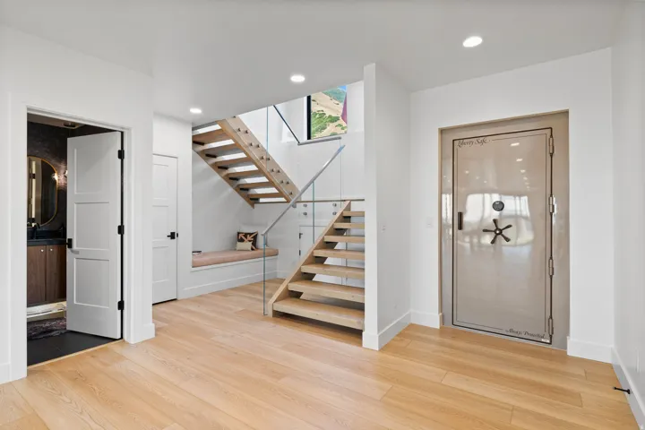 Entrance foyer with light wood-type flooring and recessed lighting