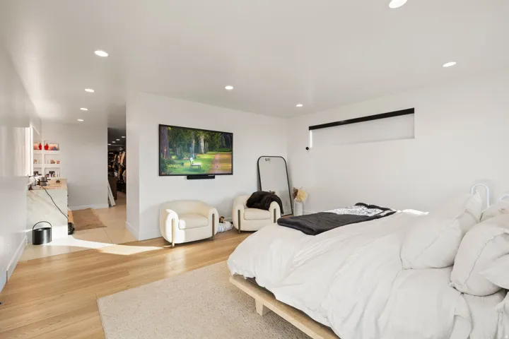 Bedroom with recessed lighting and light wood finished floors