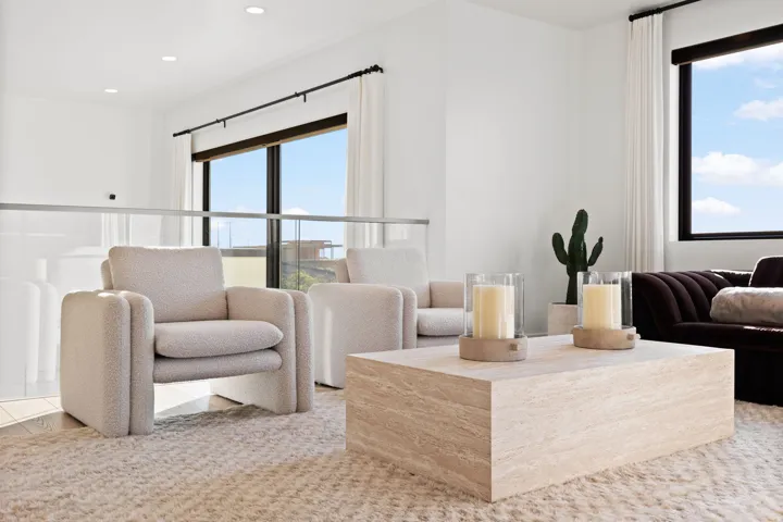 Living room with healthy amount of natural light and recessed lighting