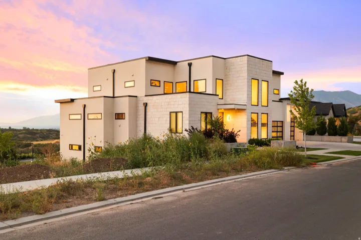 Contemporary house featuring stucco siding and a mountain view