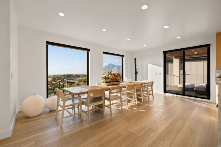 Dining space with light wood finished floors, recessed lighting, and a mountain view