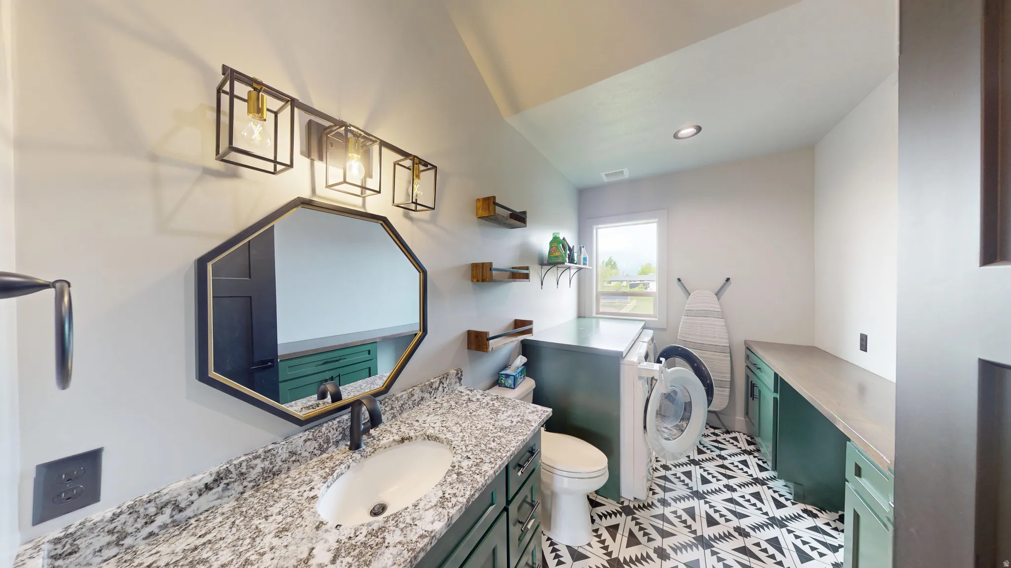 Bathroom featuring vanity and recessed lighting