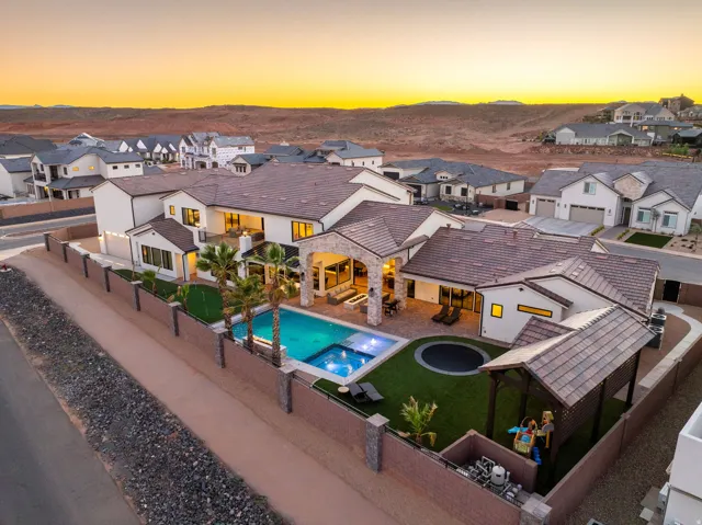 Relaxing pool / spa featuring a residential view, a patio, and a fenced backyard