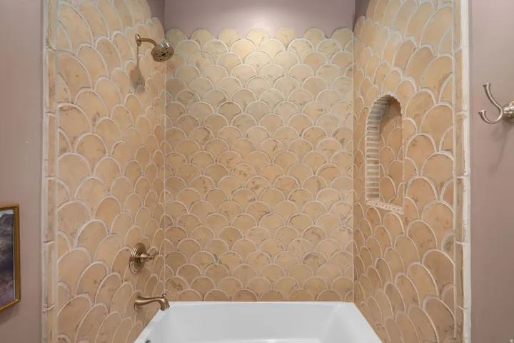 Bathroom featuring shower / washtub combination