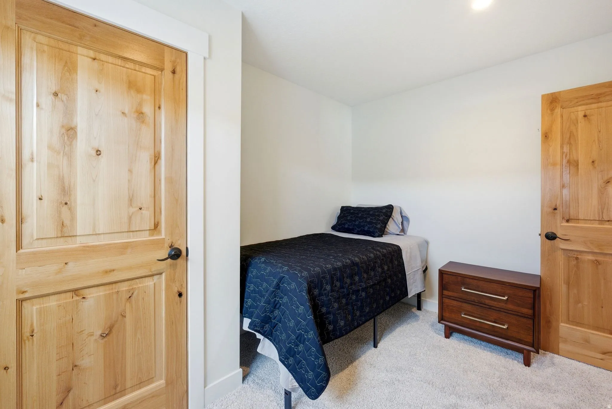 Bedroom with light colored carpet