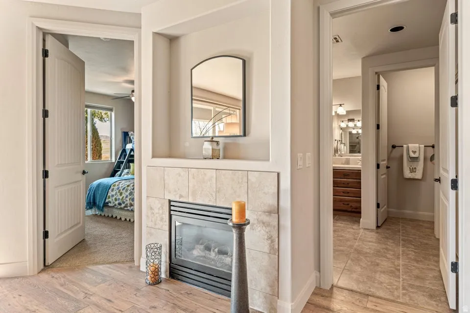 Hall with light wood-type flooring and baseboards
