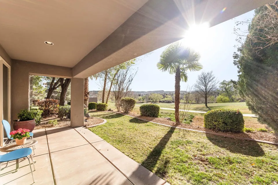 View of grassy yard with a patio