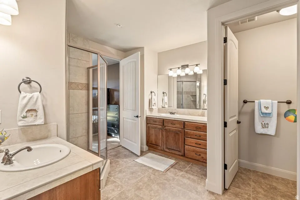 Full bathroom featuring vanity and a garden tub