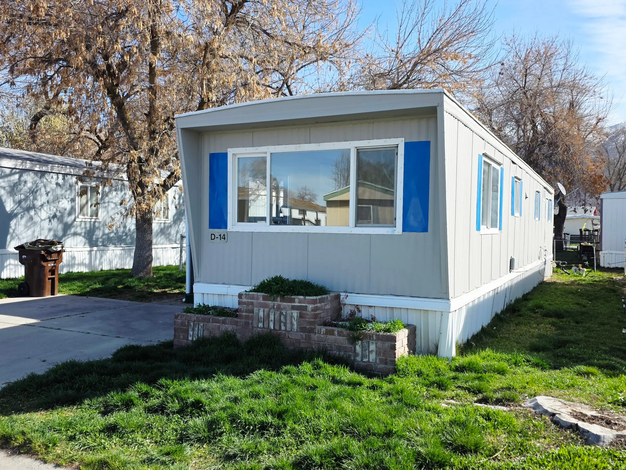 View of home's exterior with a yard