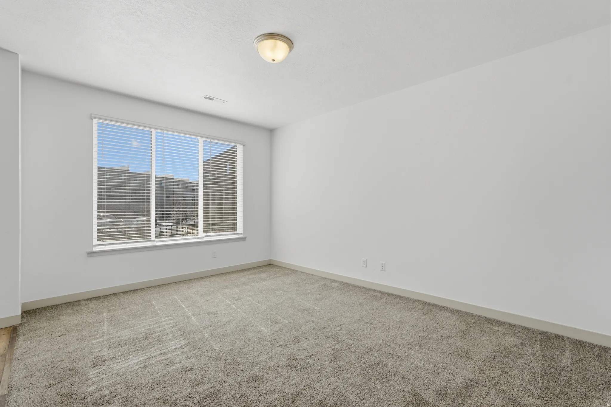 Entryway featuring stairway and light carpet