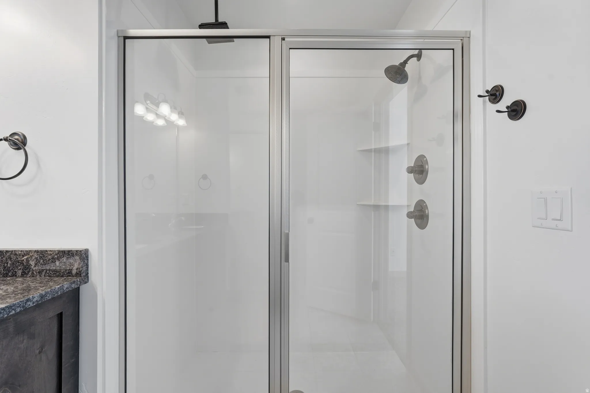 Primary bath with vanity and a stall shower