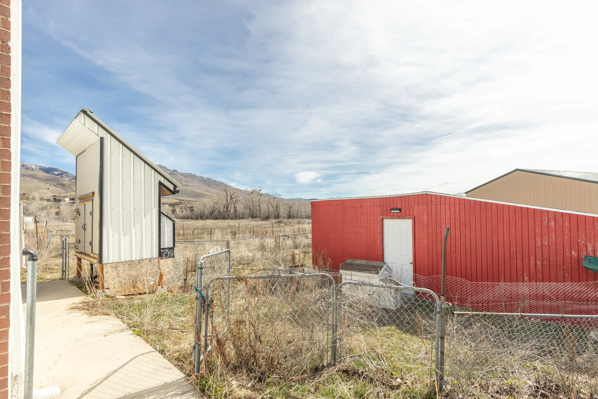 View of pole building featuring a gate