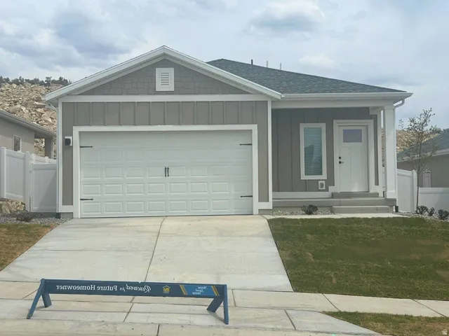 Single-story residence featuring a gray exterior with white trim