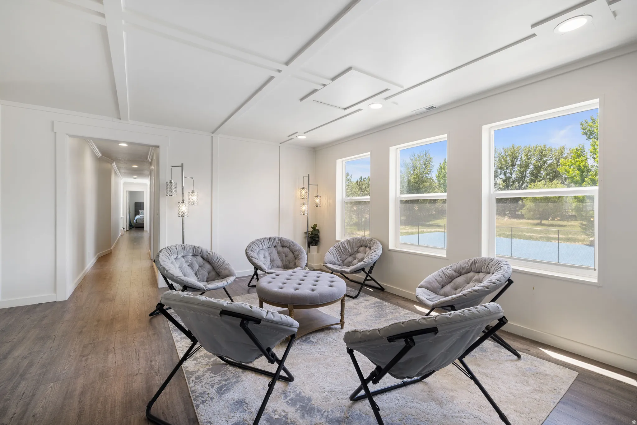 Living area featuring wood finished floors and recessed lighting