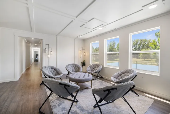 Living area featuring wood finished floors and recessed lighting