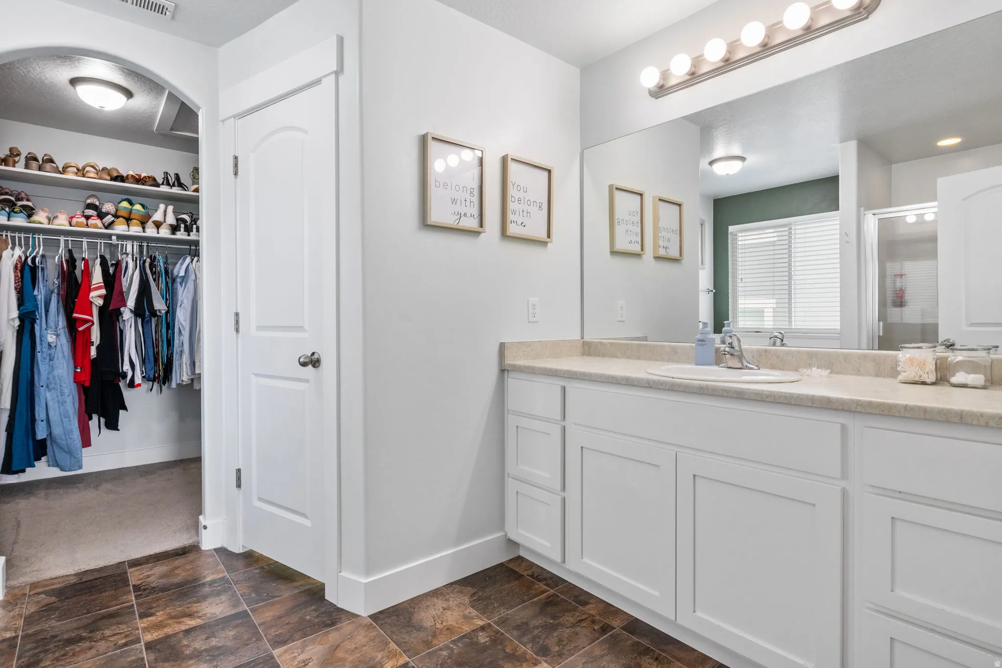 Primary bathroom with private toilet room and walk in closet.