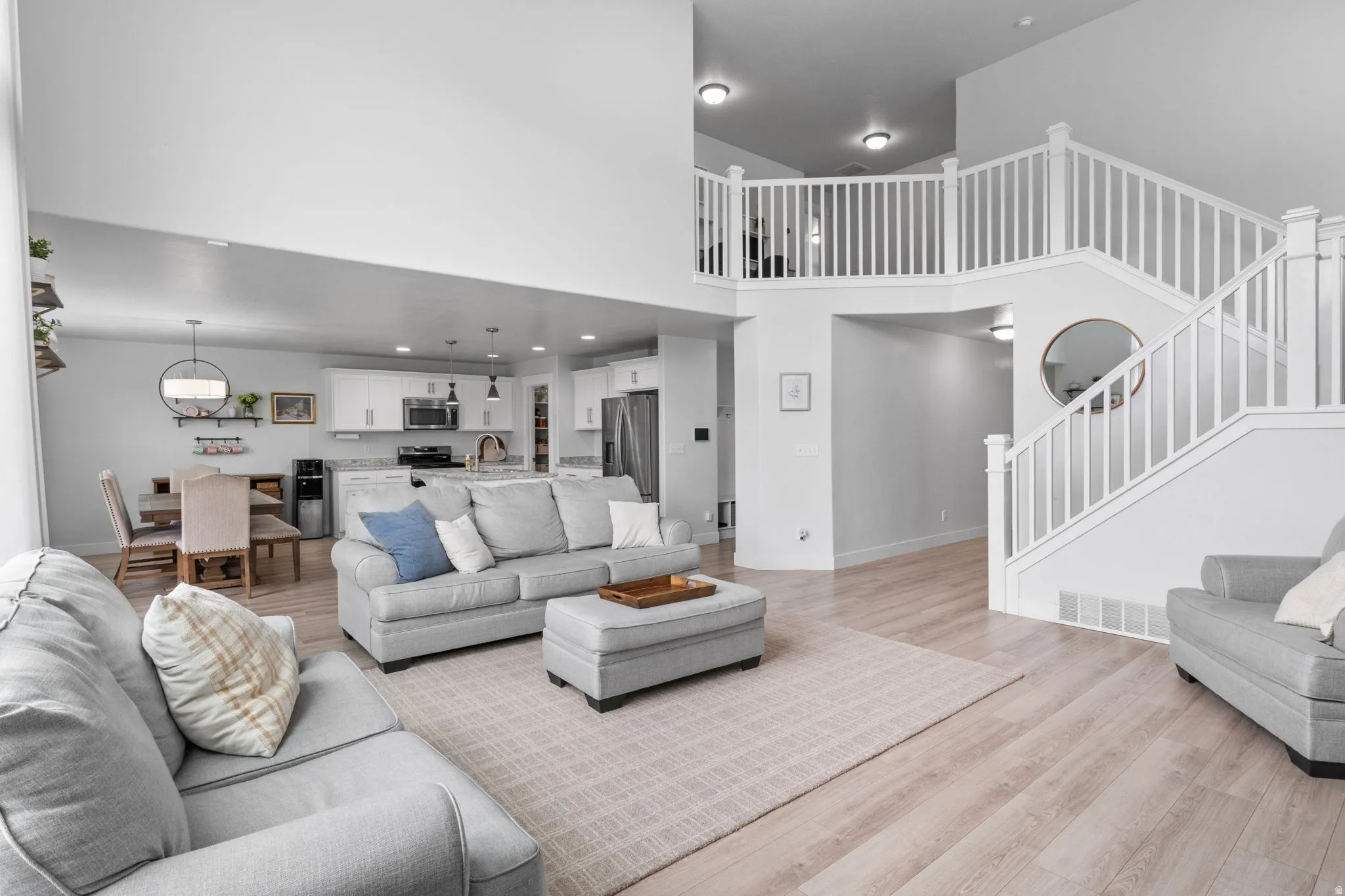 View from living room to kitchen and eat in dining.