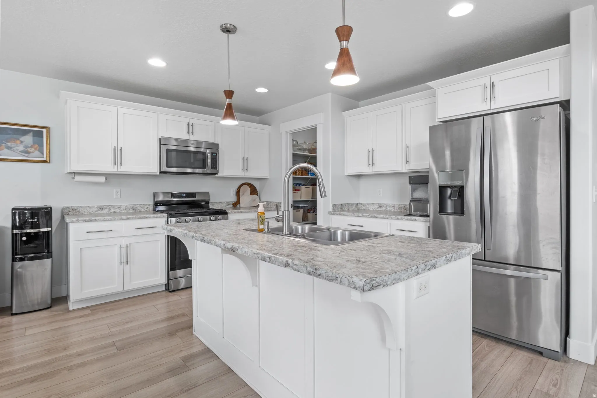 Enjoy cooking in this modern, crisp kitchen with gas range.
