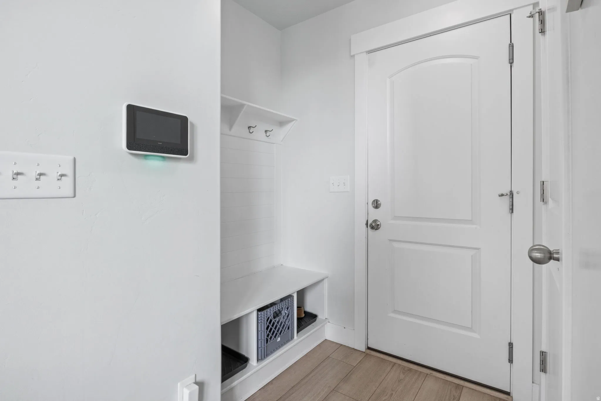 Garage entry with a storage bench