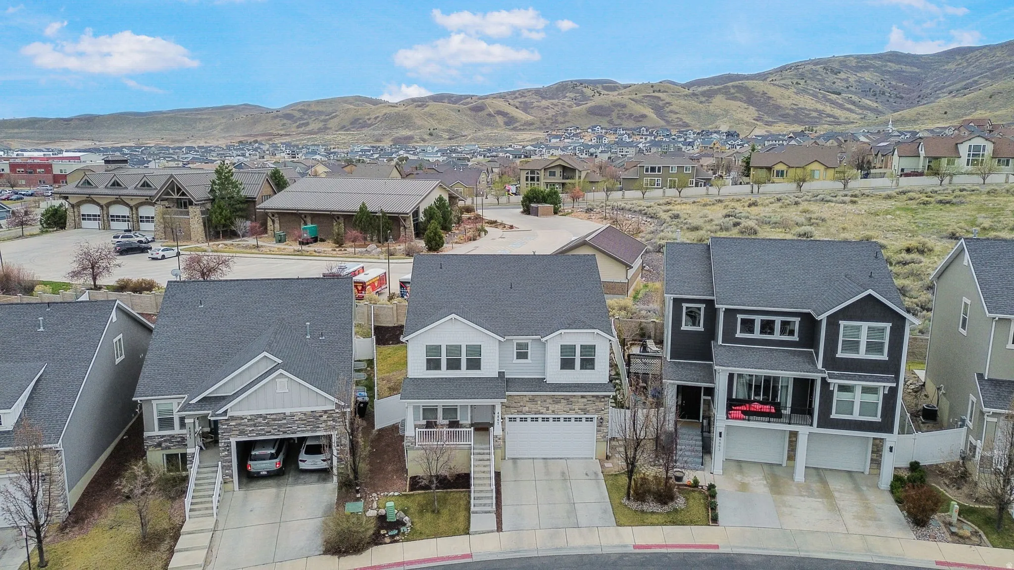 Aerial view of residential area featuring mountains