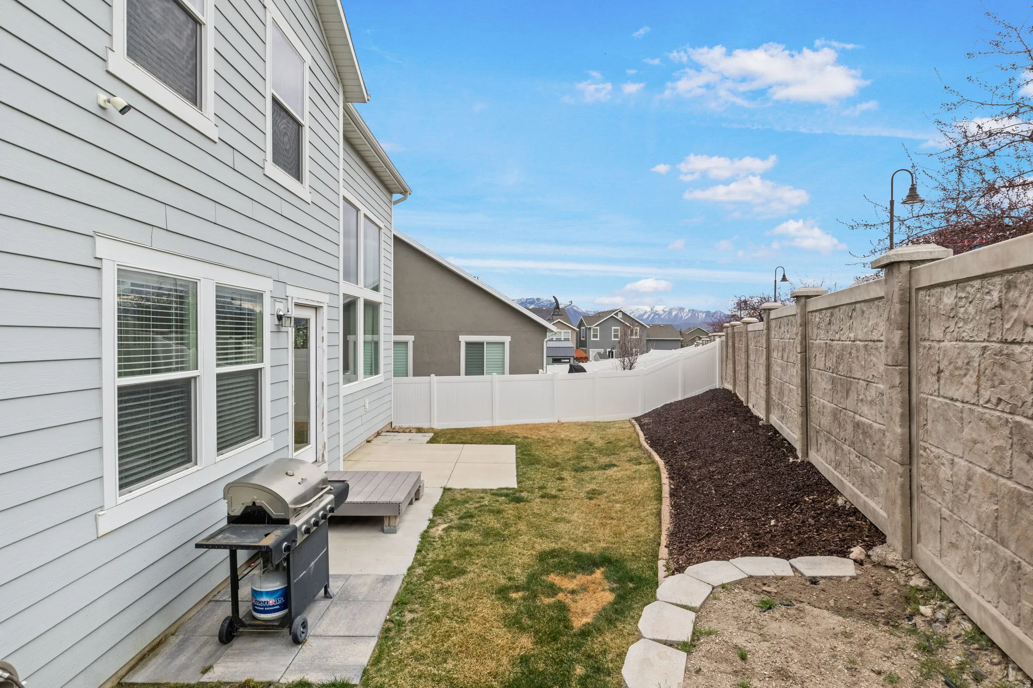 Fenced backyard featuring a patio area